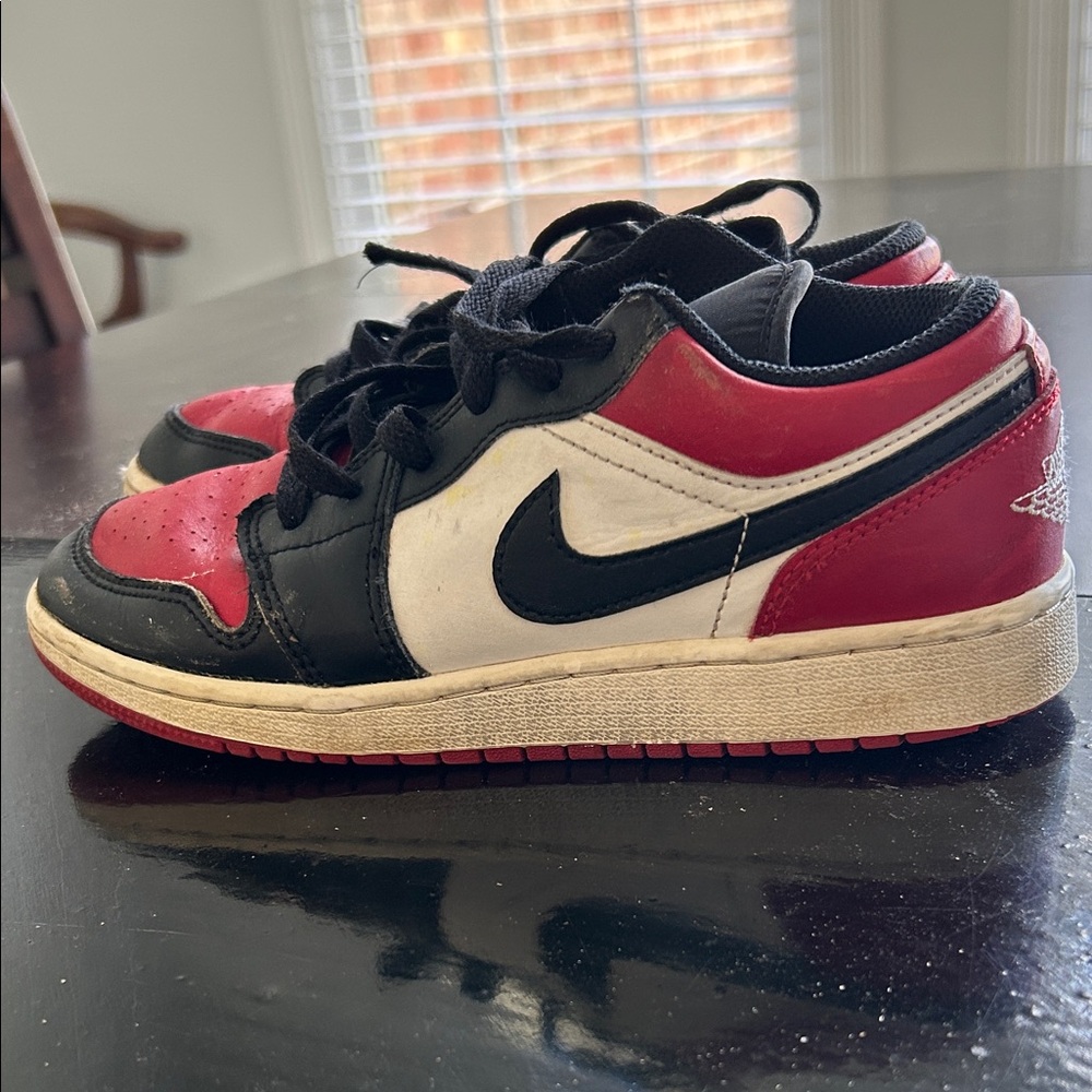 Nike  Air Jordan 1 Low Bred Toe Black and Red Low-Top Sneakers